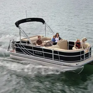A boat with four people on it in the water.