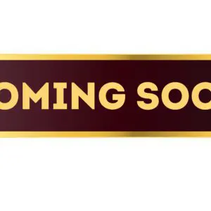 A sign that says coming soon with gold lettering.