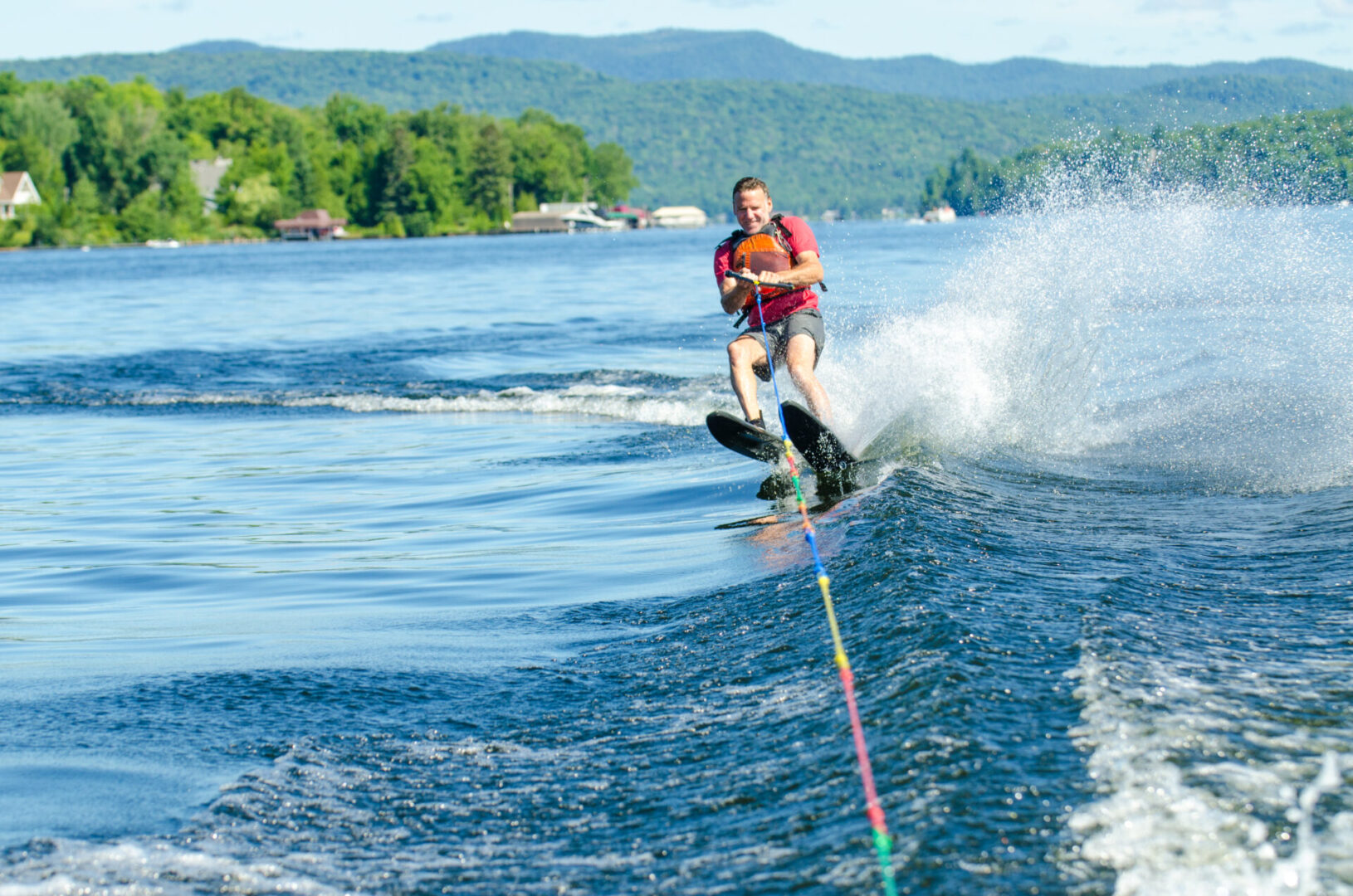 A person on water skis in the middle of a lake.