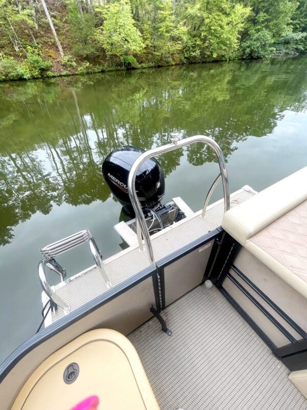 Pontoon boat with a Mercury engine.