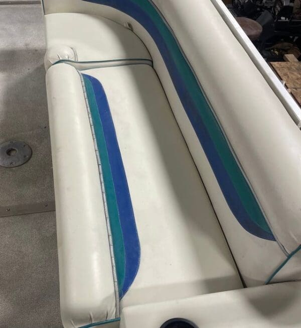 White and blue boat seat with stripes.